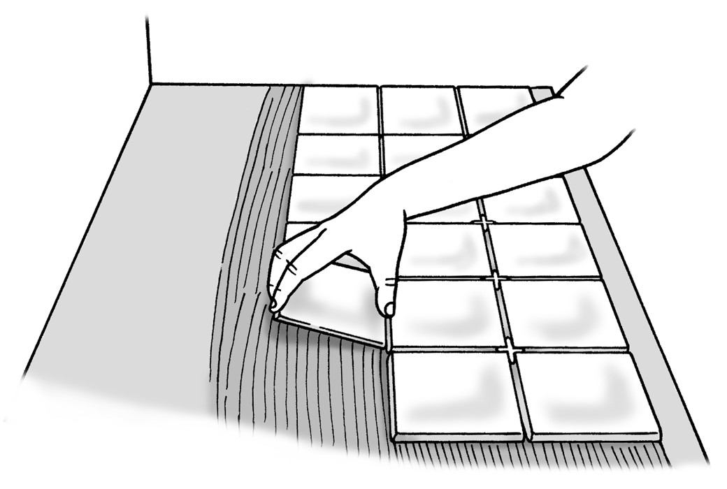 Figure 8-14: Lay the tiles flat on the adhesive and then push them down to ensure full contact with the adhesive.